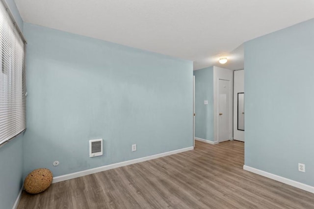 spare room with light wood-type flooring