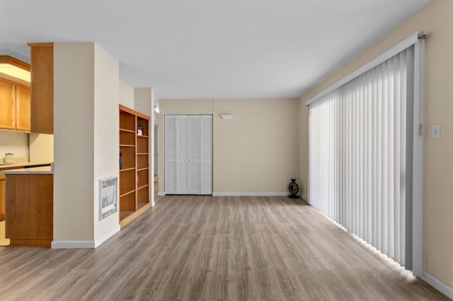 unfurnished living room featuring light wood-type flooring