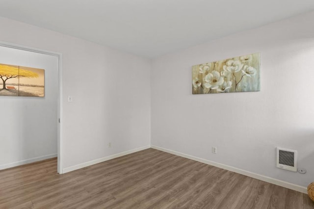 spare room featuring hardwood / wood-style flooring