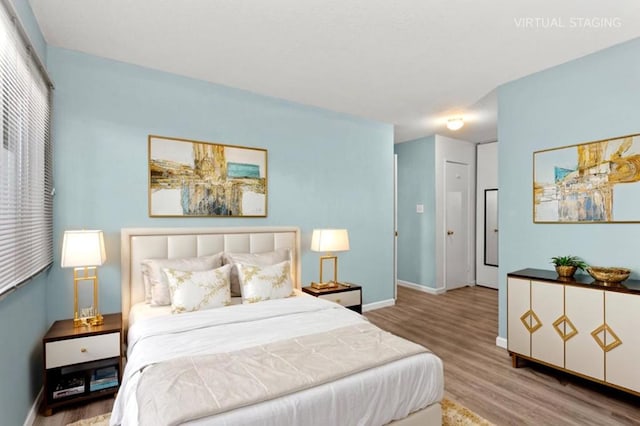 bedroom featuring hardwood / wood-style flooring and a closet