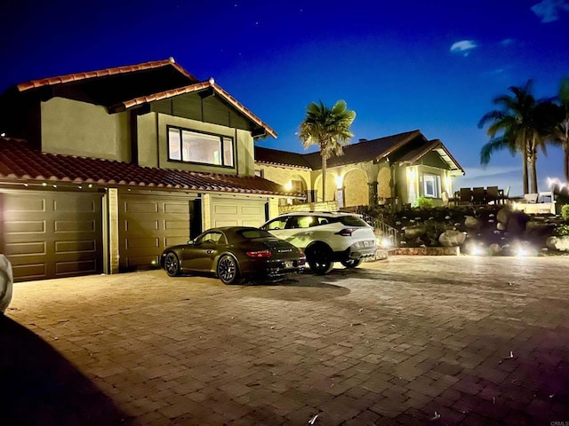 mediterranean / spanish house with a garage