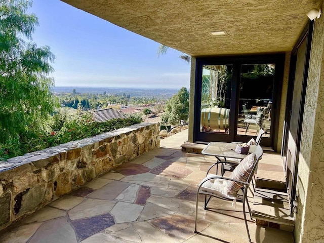 view of patio featuring french doors