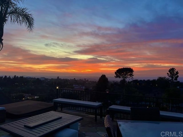 view of patio terrace at dusk