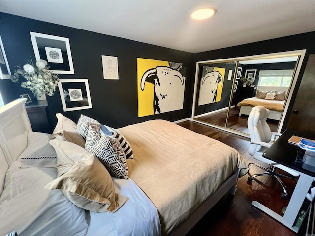 bedroom featuring a closet and wood finished floors