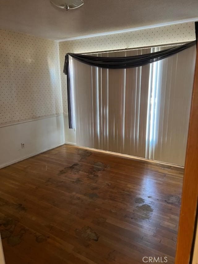 empty room featuring dark hardwood / wood-style floors