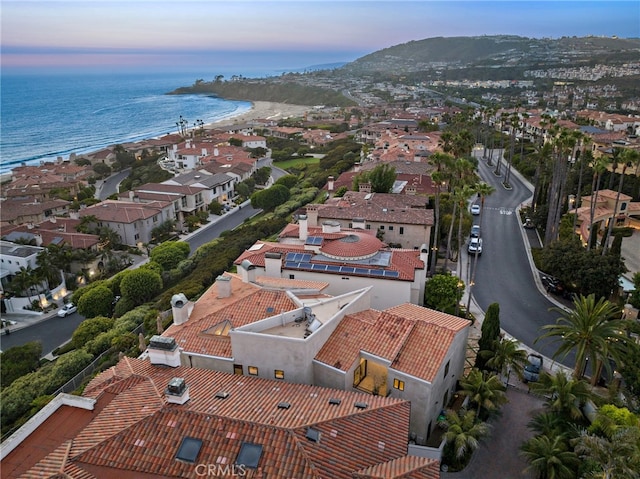 aerial view at dusk with a water view