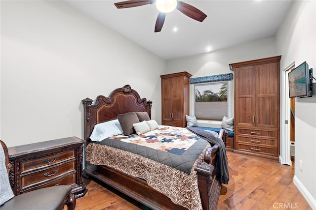 bedroom featuring ceiling fan and light hardwood / wood-style flooring