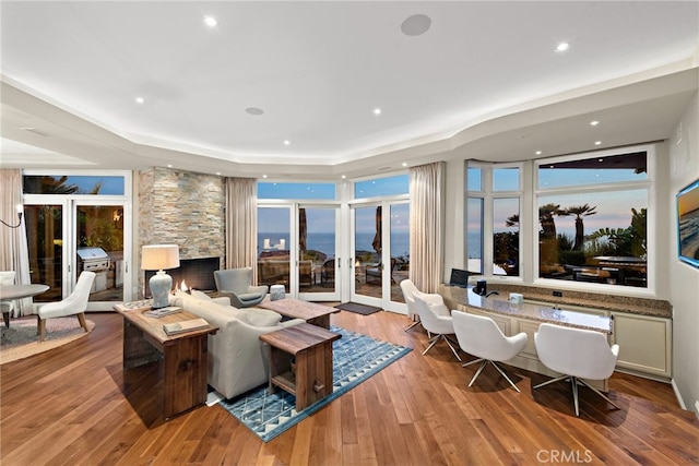 living room featuring light hardwood / wood-style floors and french doors