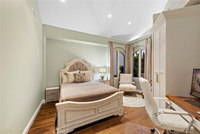 bedroom featuring dark hardwood / wood-style flooring