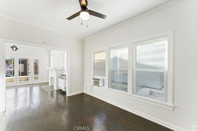 unfurnished living room with plenty of natural light, dark hardwood / wood-style floors, ceiling fan, and cooling unit