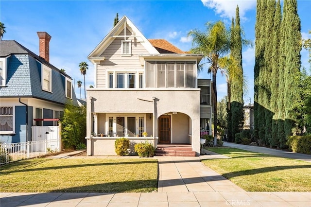 view of front facade with a porch and a front yard