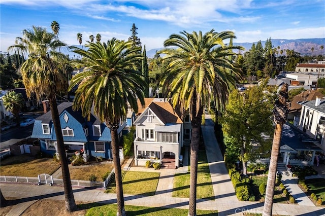 birds eye view of property featuring a mountain view