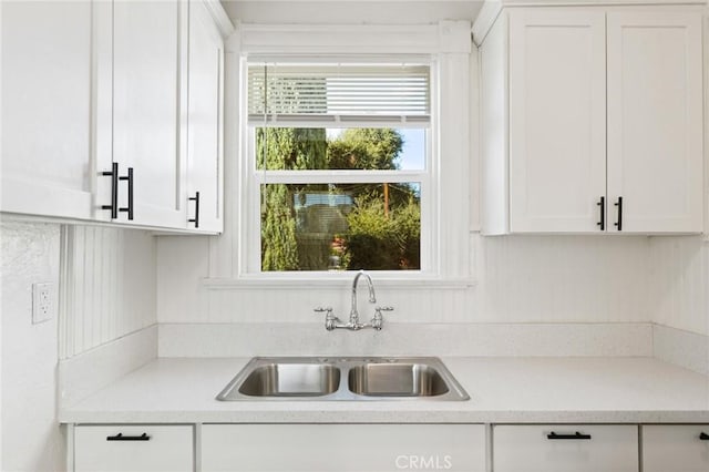 kitchen with sink and white cabinets