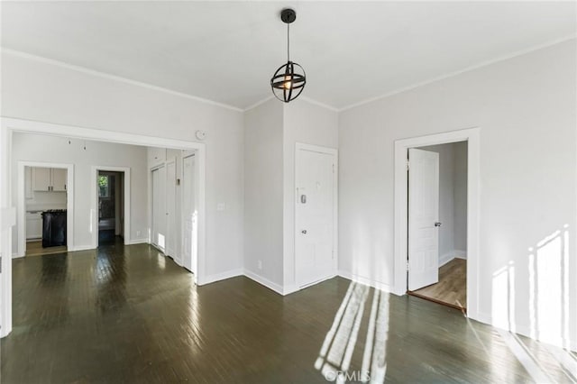 interior space featuring dark wood-type flooring and an inviting chandelier