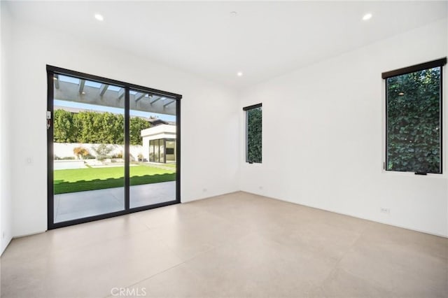 unfurnished room featuring recessed lighting