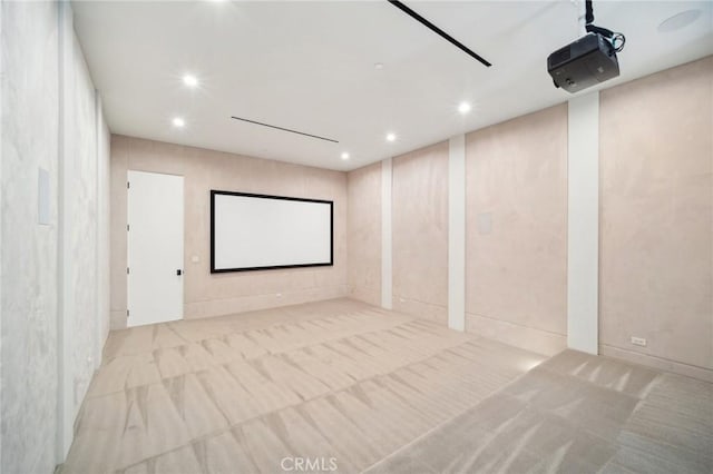 home theater room featuring a garage and recessed lighting