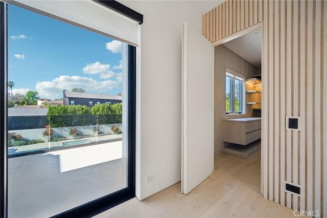 doorway with light wood-style flooring