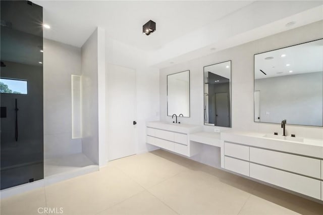 full bath with recessed lighting, two vanities, a sink, a walk in shower, and tile patterned floors