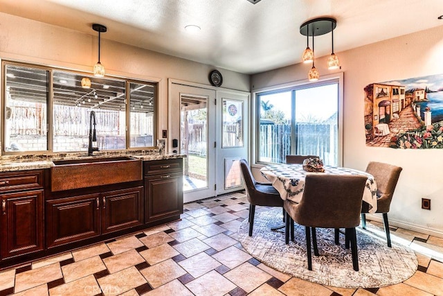 dining area with sink and a healthy amount of sunlight