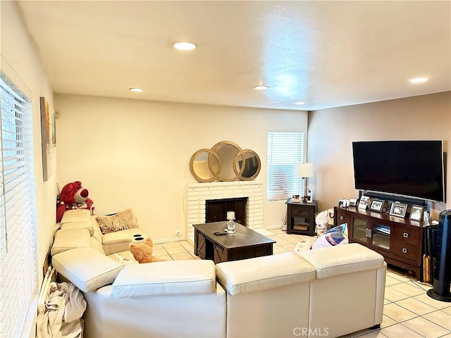 tiled living room featuring a fireplace