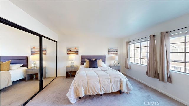 carpeted bedroom featuring a closet