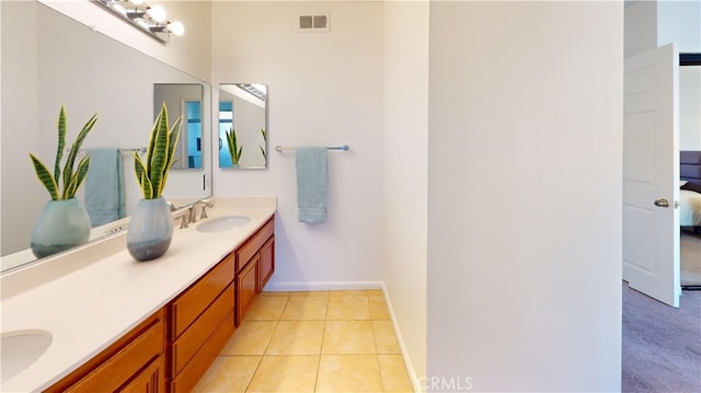 bathroom with tile patterned floors and vanity