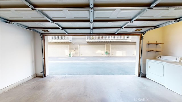 garage featuring washer and clothes dryer