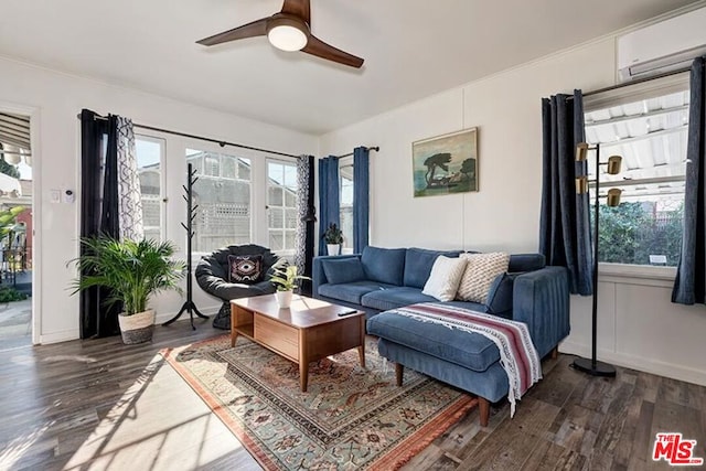 living room featuring ceiling fan, dark hardwood / wood-style flooring, and a wall mounted AC