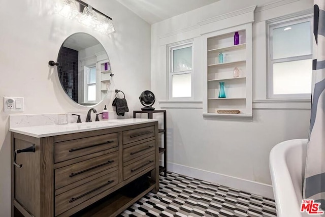 bathroom featuring plenty of natural light and vanity