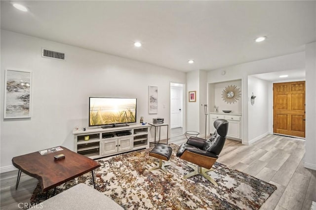 living room with light hardwood / wood-style floors