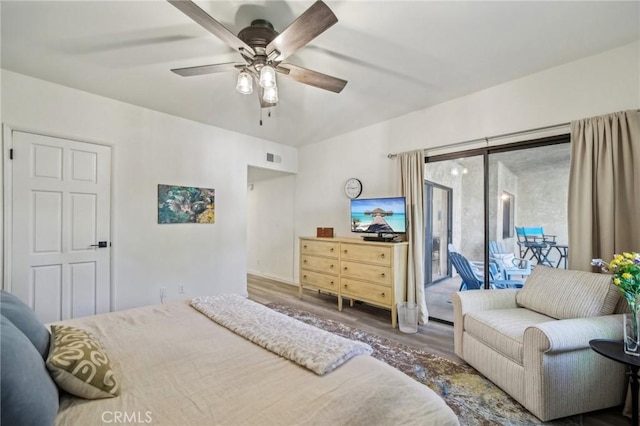 bedroom with ceiling fan, access to exterior, and dark hardwood / wood-style flooring