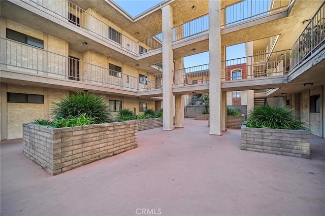 view of home's community featuring a patio area