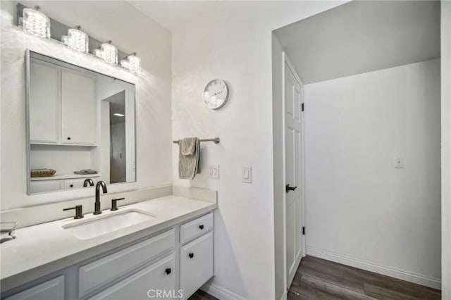 bathroom featuring wood-type flooring and vanity