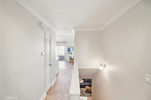 hallway featuring ornamental molding