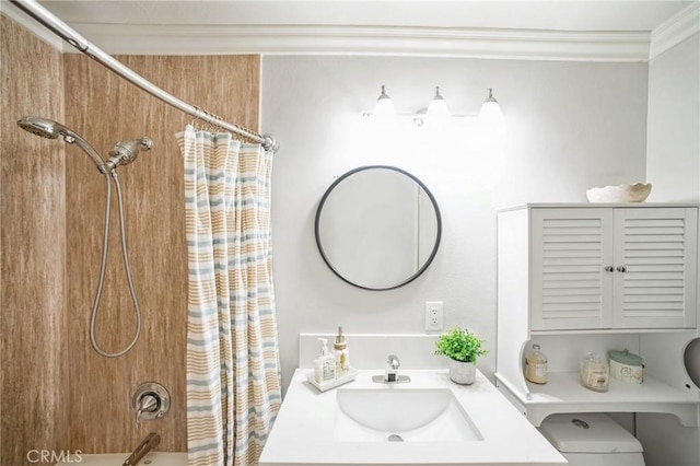 bathroom with vanity, crown molding, and shower / bathtub combination with curtain