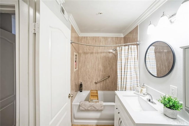 bathroom with shower / tub combo with curtain, vanity, and ornamental molding