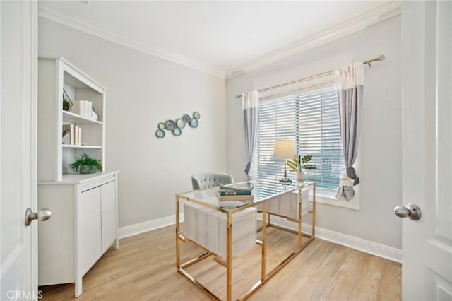 home office with light hardwood / wood-style floors and ornamental molding