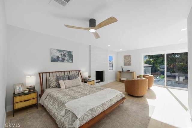 bedroom with access to outside and ceiling fan