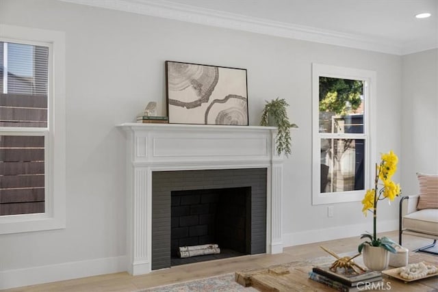 living room featuring light wood-type flooring and ornamental molding