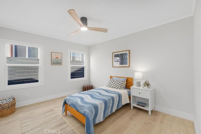 bedroom with ceiling fan and light wood-type flooring