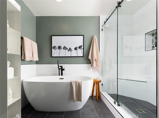 bathroom featuring tile patterned floors and plus walk in shower