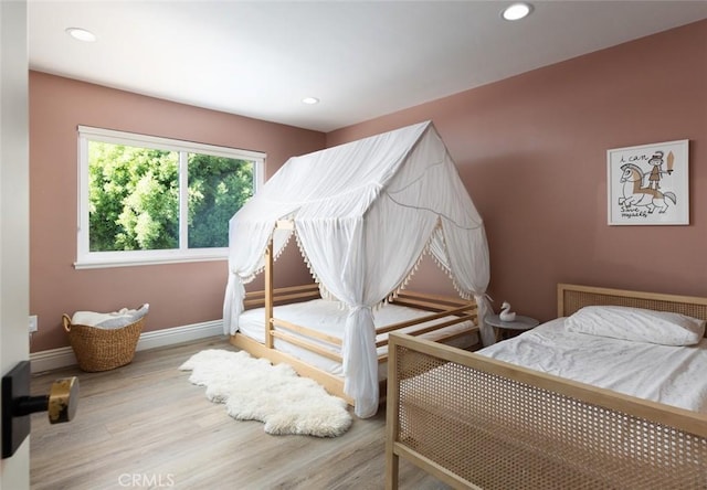 bedroom featuring hardwood / wood-style flooring