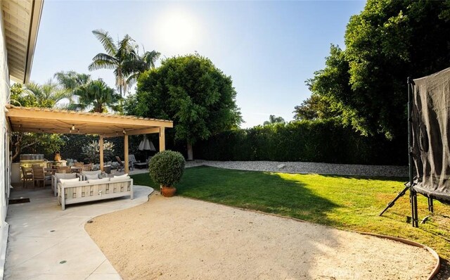 view of yard with an outdoor living space, a patio, and a pergola