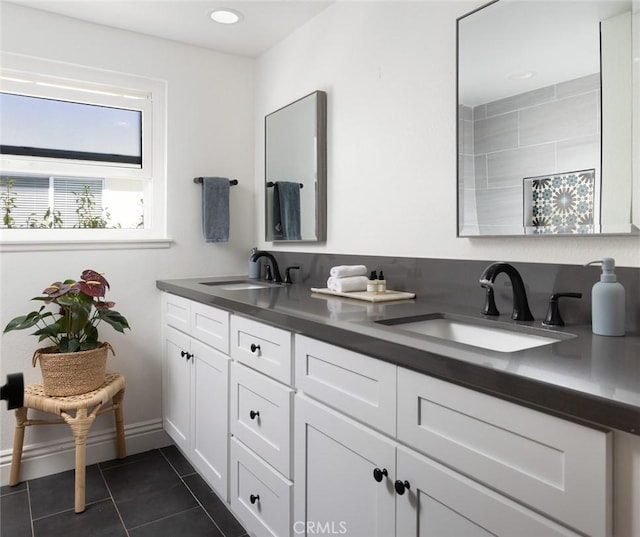 bathroom with tile patterned flooring and vanity