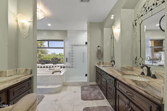 bathroom featuring tile patterned floors, vanity, and independent shower and bath