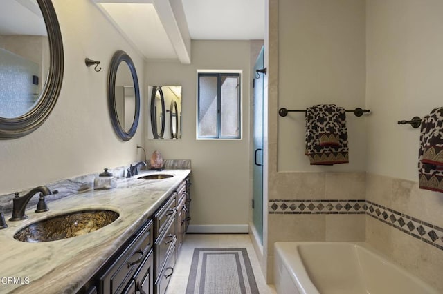 bathroom with tile patterned floors, separate shower and tub, vanity, and tile walls