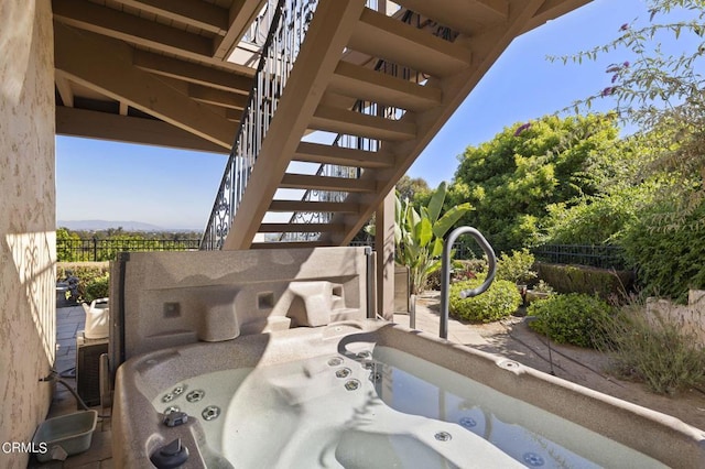 view of patio / terrace with a hot tub