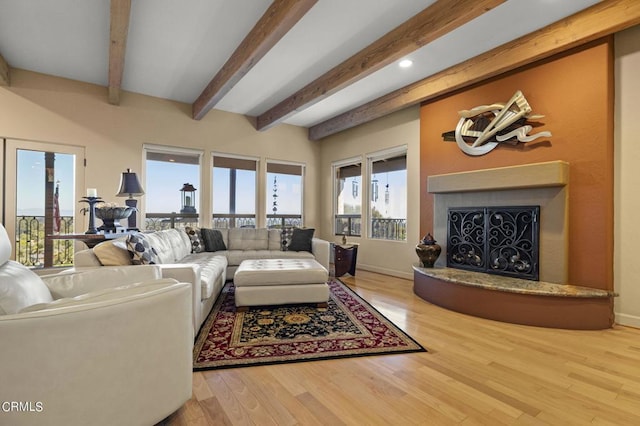 living room featuring hardwood / wood-style floors and beam ceiling