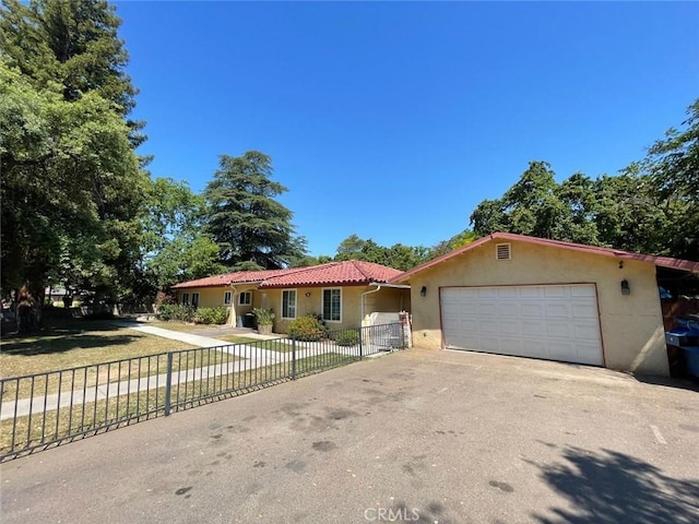 ranch-style home featuring a garage