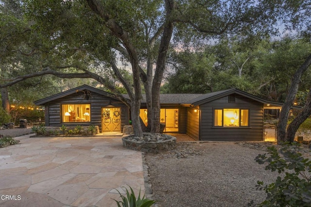 log cabin featuring a patio